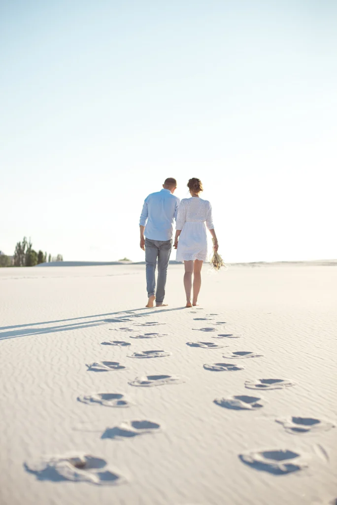 Couple walking on sand