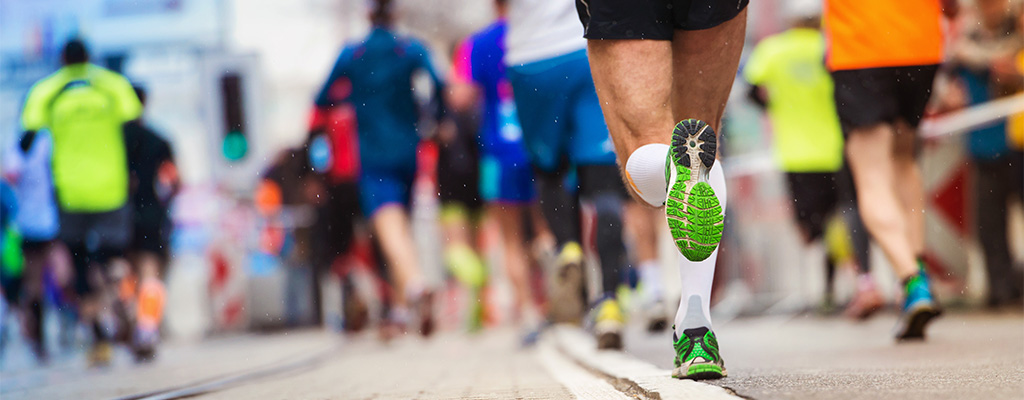 Shot of runner legs on street